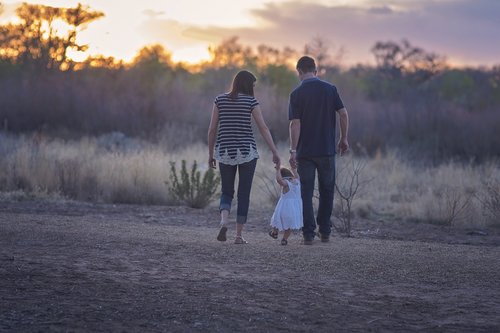 Parents walking with a toddler